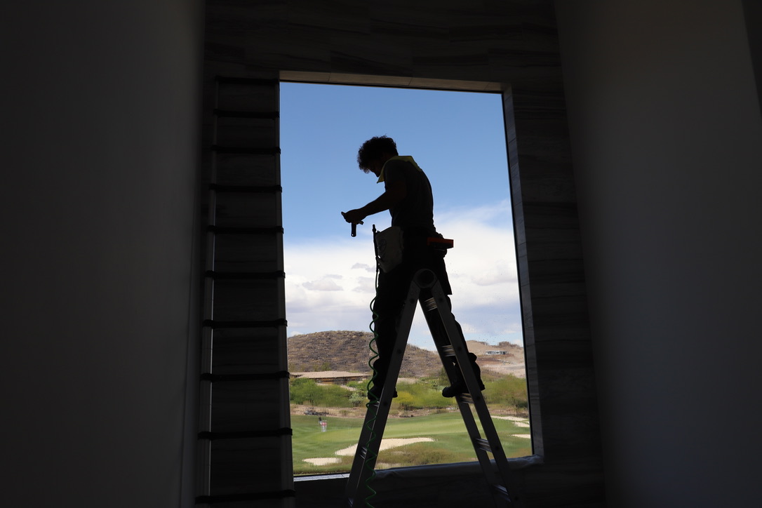 Window film installation silhouette Las Vegas luxury home