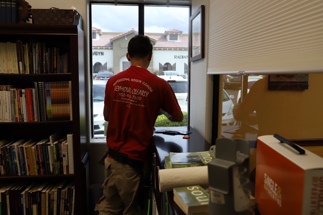 Nicholas Seymour Clearly installing office window film