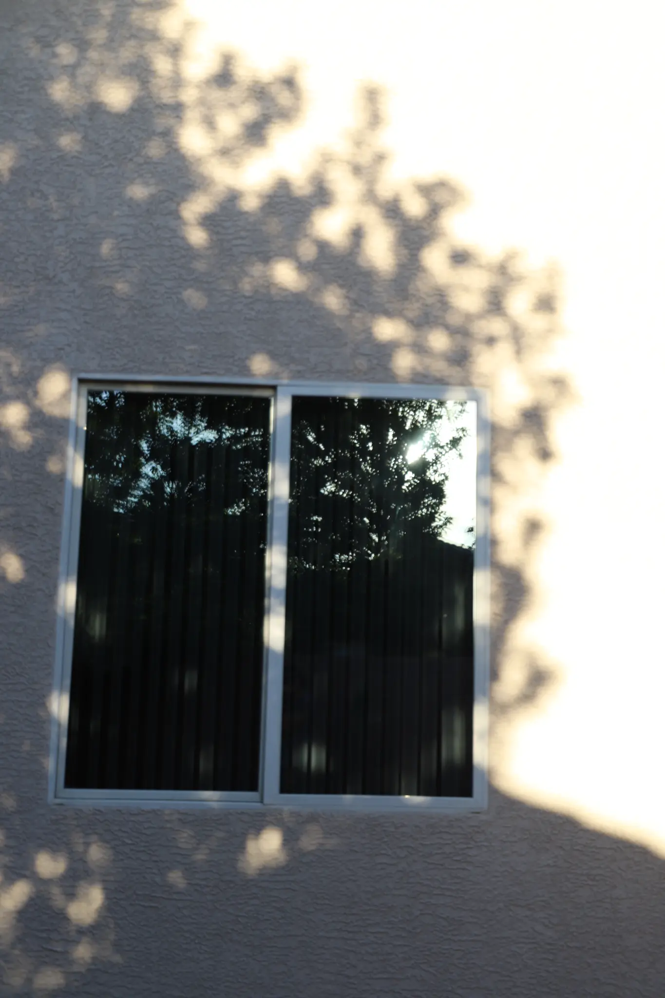 Residential side windows after solar film installation