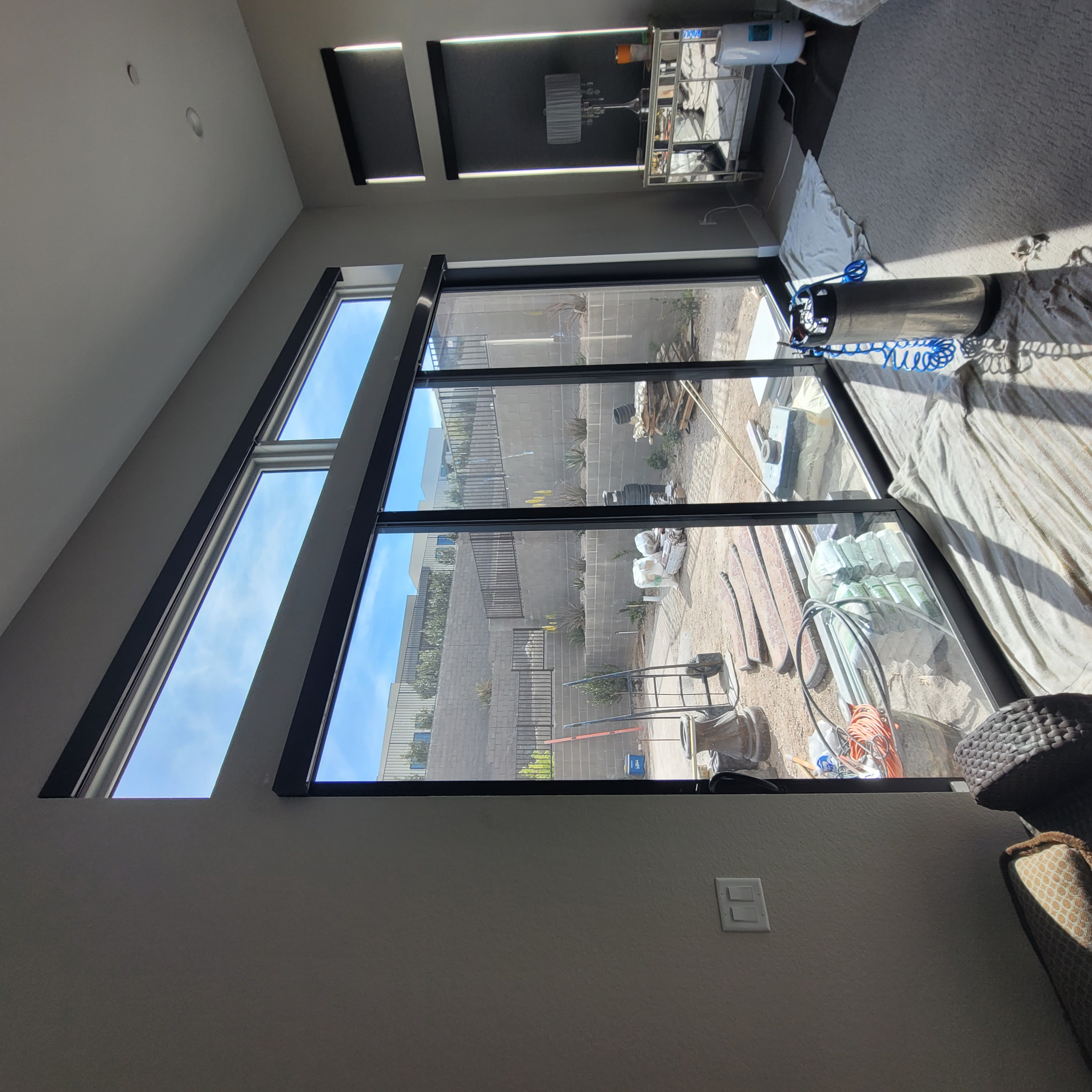 Luxury home bedroom before window tinting 3-panel sliding door