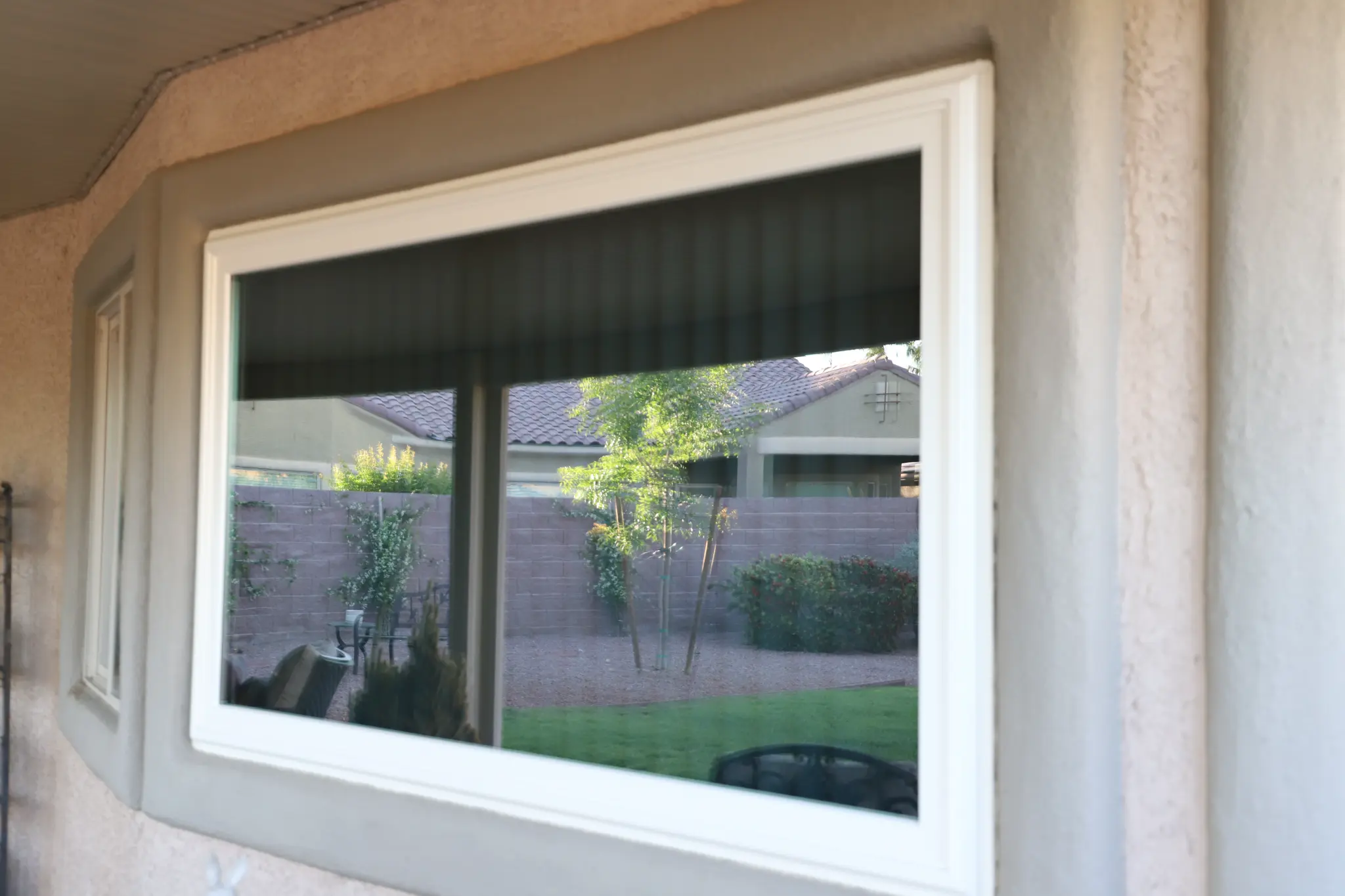 Close-up patio window after solar film installation