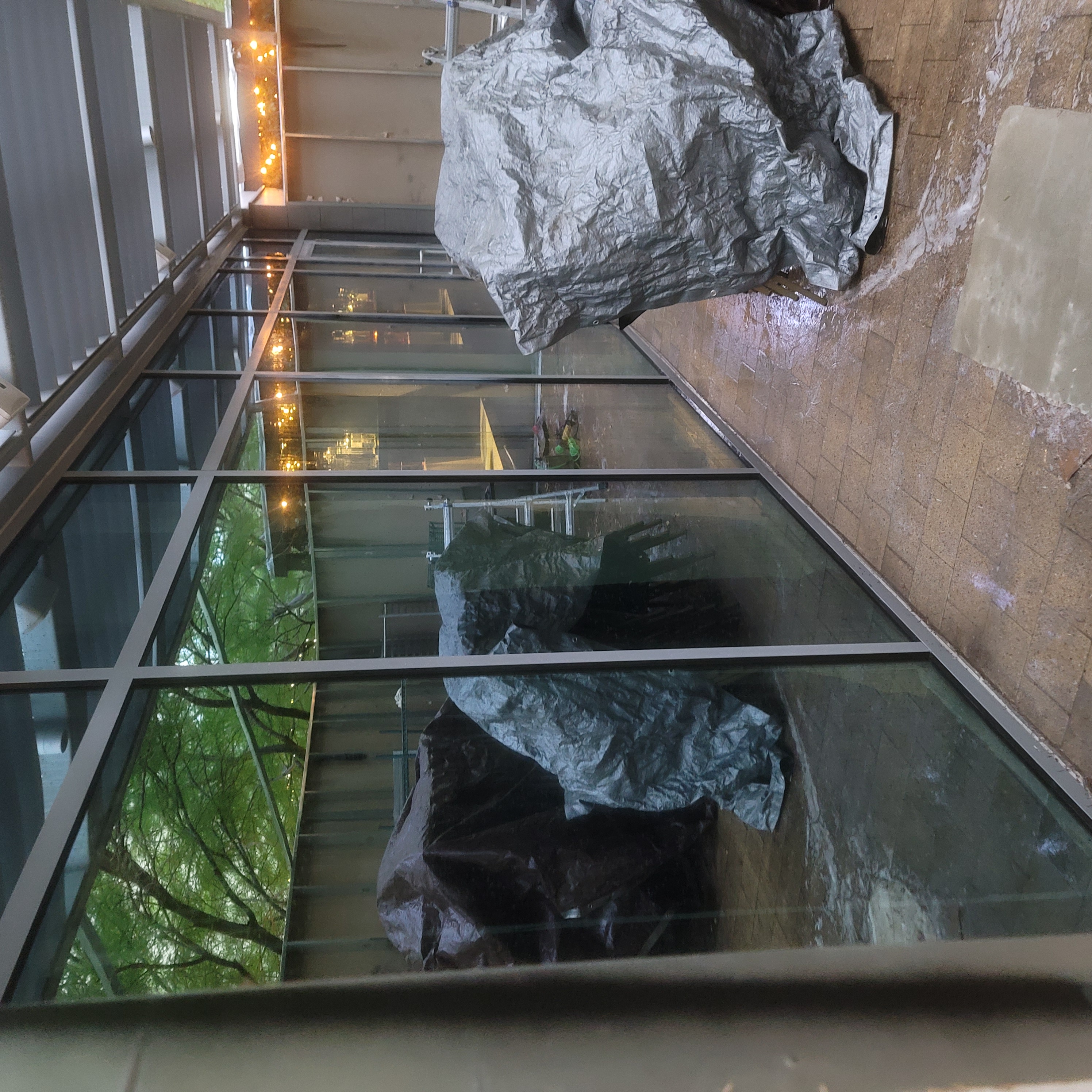Glass patio enclosure before solar film wide view