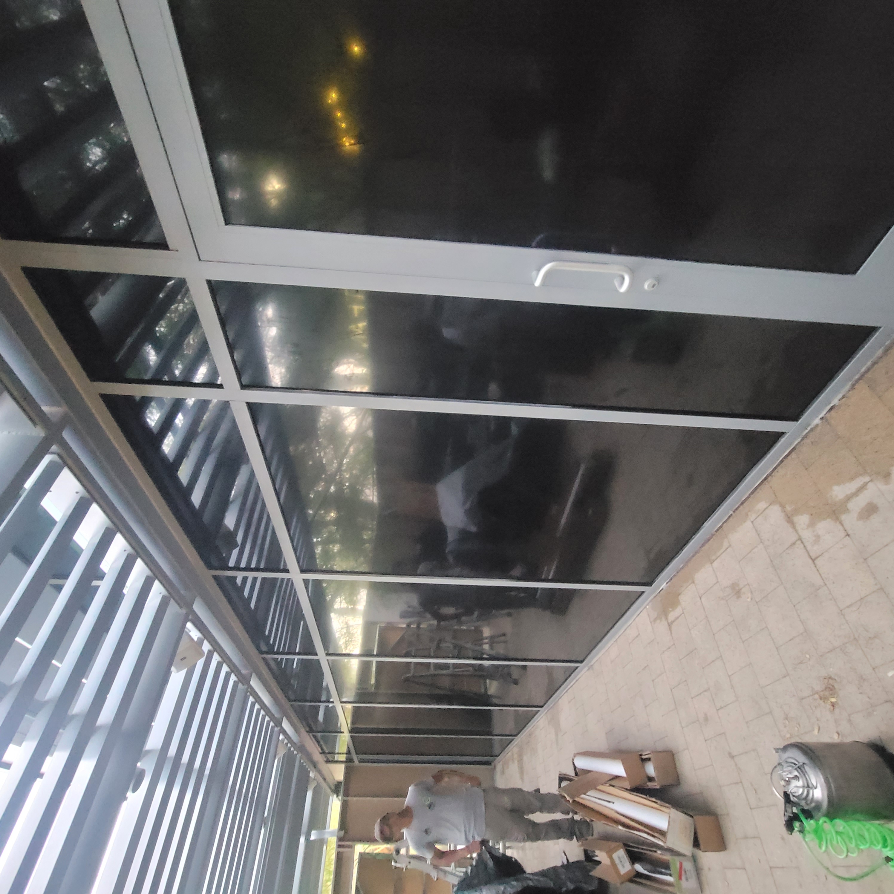 Seymour Clearly technician installing glass enclosure window film