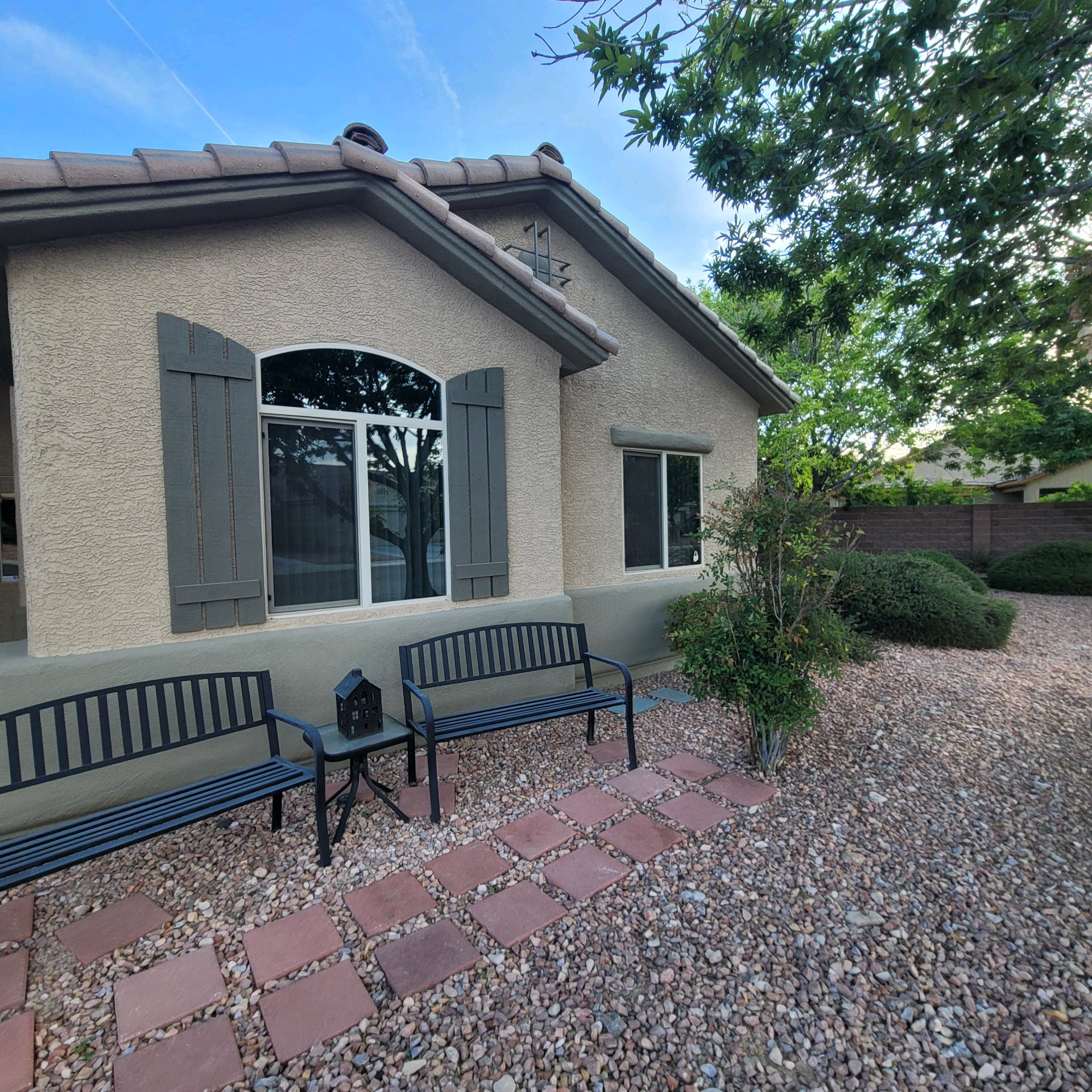 Upscale home arched window after solar tinting