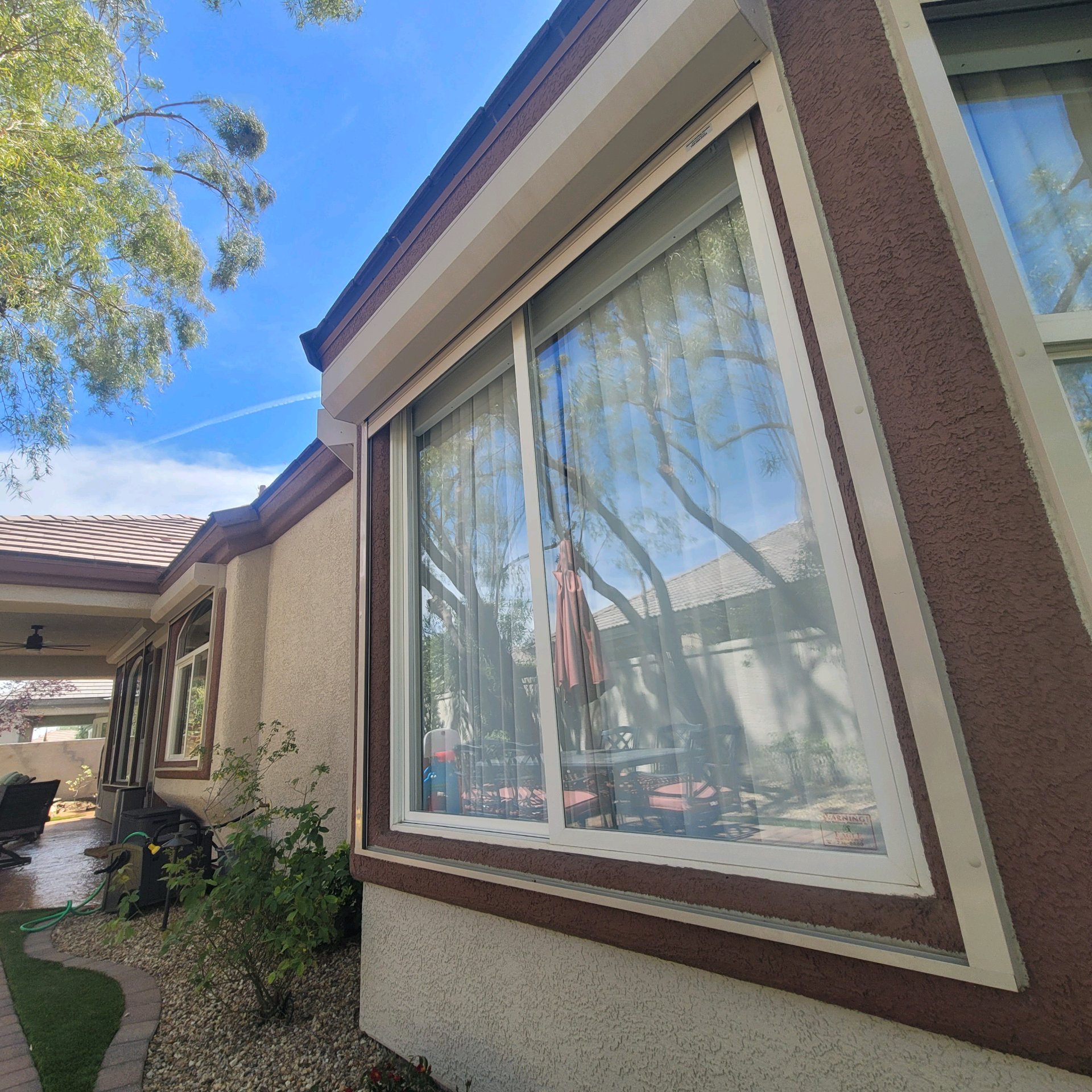 Residential patio home before window tinting clear glass